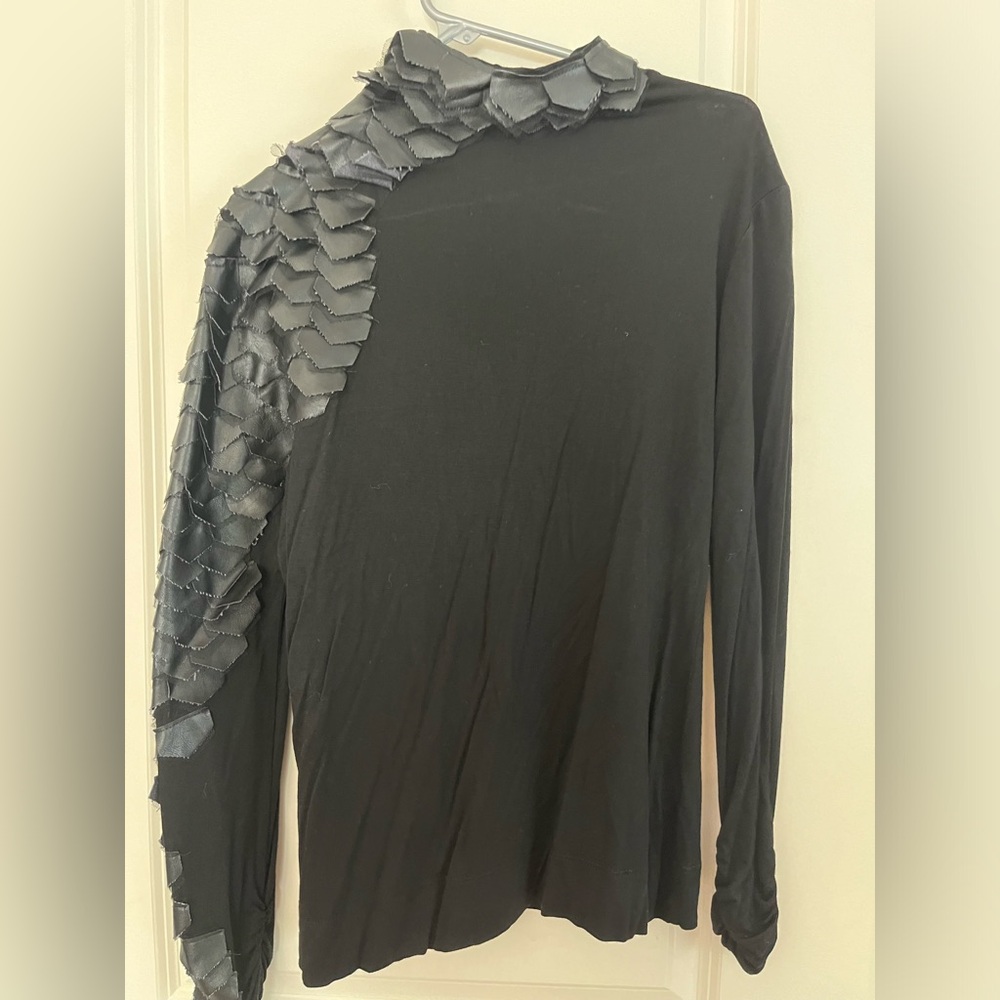 Unique mock turtleneck with faux leather scales, gathered cuffs